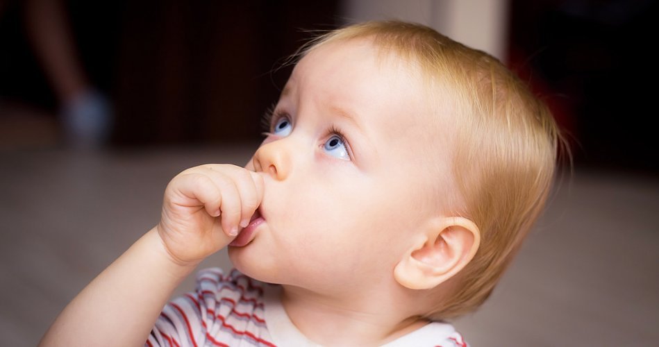 Child sucking their thumb